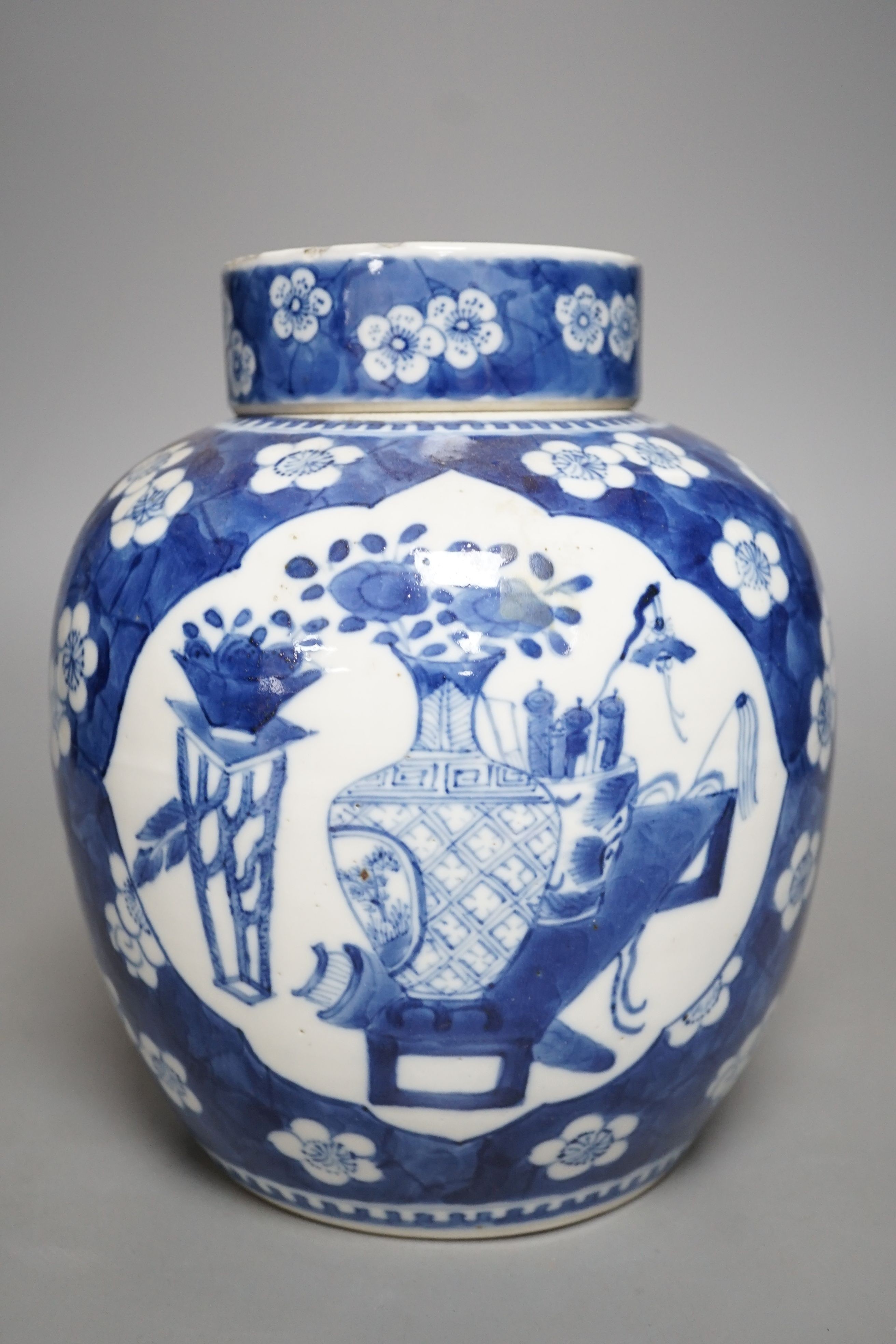 A 19th century Chinese blue and white ginger jar and cover - 20.5cm tall